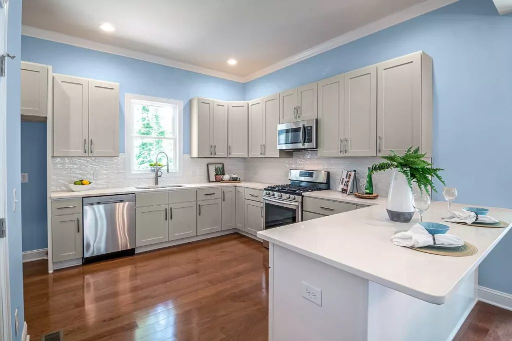 Gray kitchen Cabinets blue wall