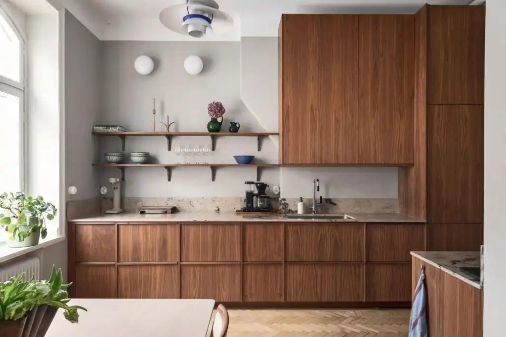Light grey walls and dark wood kitchen cabinets