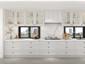 A bright kitchen featuring light plywood cabinets, glass-fronted upper cabinets, and marble countertops, creating a fresh and elegant cooking space.
