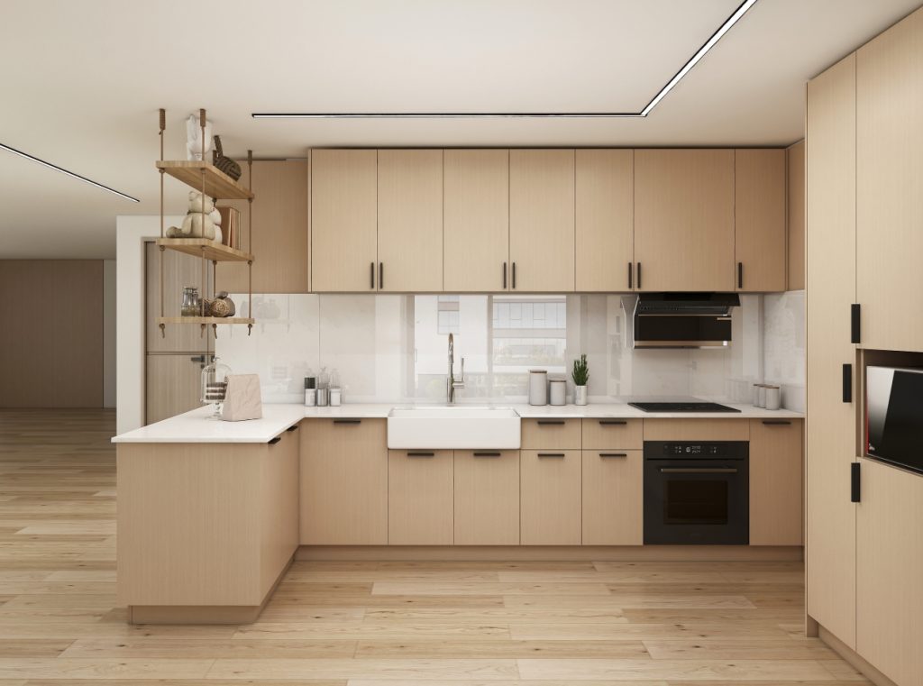 Minimalist kitchen with light wood cabinets and white countertops.