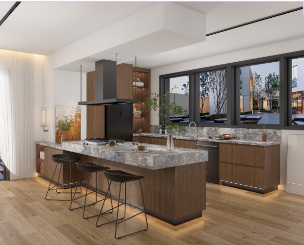 Modern kitchen featuring a marble island, dark wood cabinetry, and sleek black appliances.
