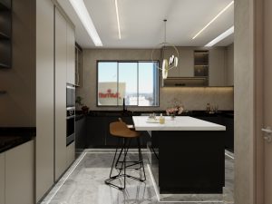 Modern kitchen with a marble island, sleek beige and black cabinetry, and a large window offering natural light.