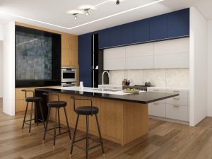 A contemporary kitchen featuring two-tone cabinets in navy blue and light gray, complemented by a black countertop and wooden accents.