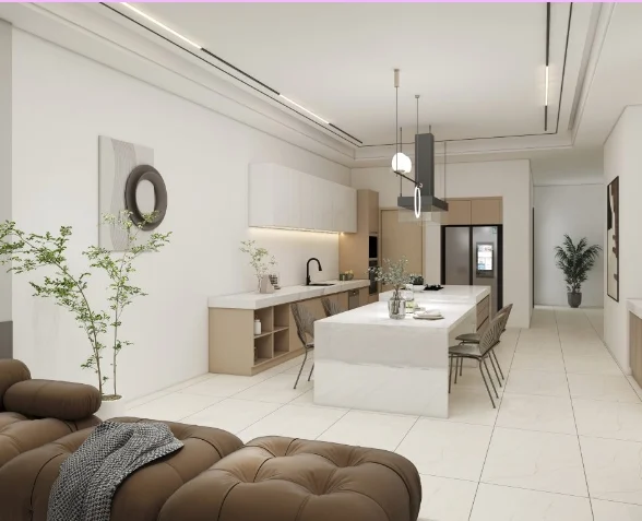 Bright, minimalist kitchen featuring a marble island, soft-tone cabinetry, and an open-plan layout.