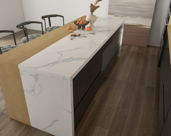 Close-up of a modern minimalist kitchen island with a marble countertop and light wood accents.