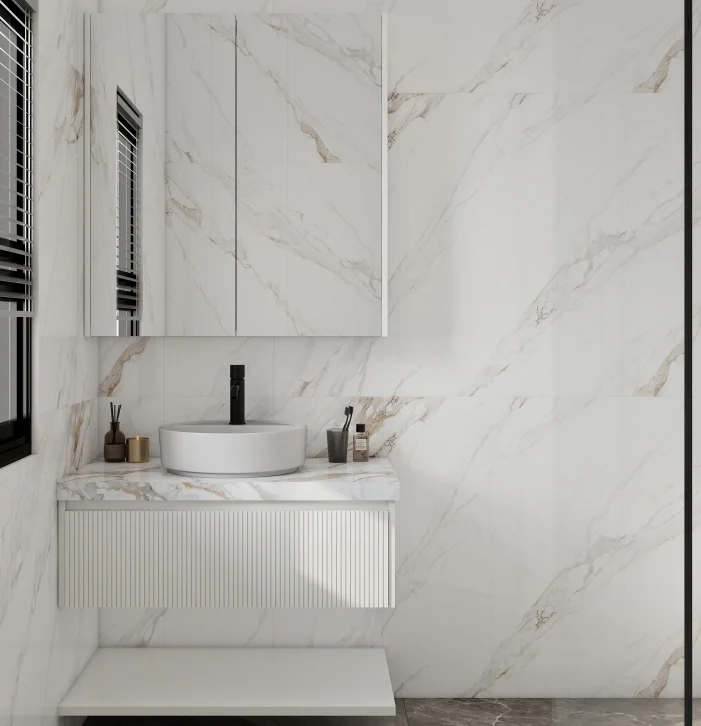 Contemporary bathroom vanity with dual round sinks and marble detailing.
