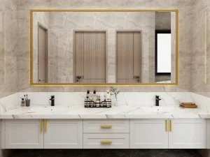 Modern double-sink vanity with a marble countertop, white cabinetry, and gold accents, complemented by a large gold-framed mirror.