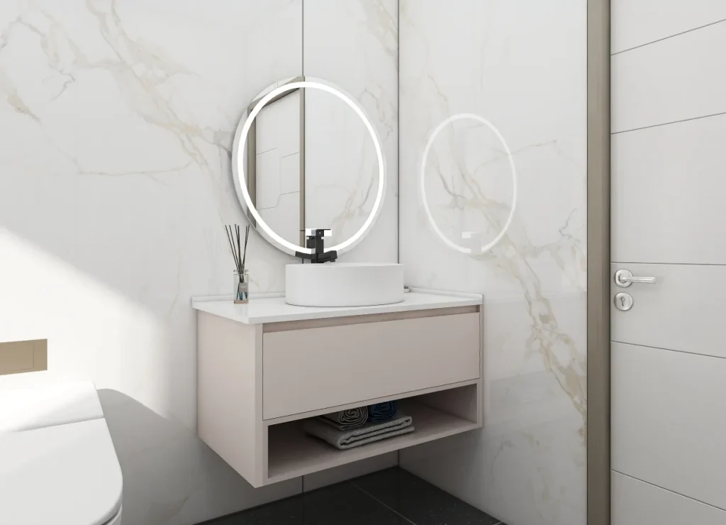 Contemporary bathroom vanity with a circular mirror and neutral-toned storage.