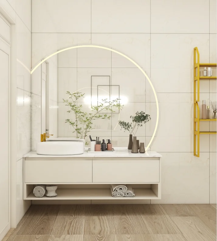Sleek bathroom vanity with white drawers and wood countertop, featuring a round LED mirror and vertical green garden for a fresh, modern look.