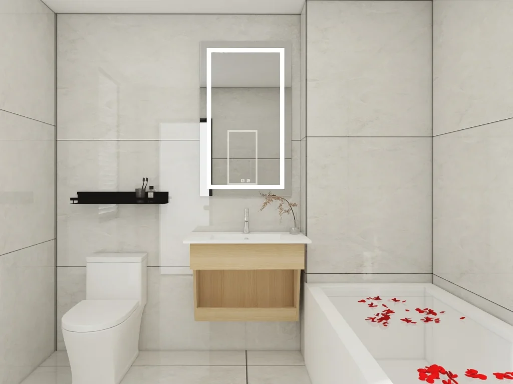 Modern bathroom featuring a light wood vanity with an integrated white countertop, set against large beige tiles and complemented by a rectangular illuminated mirror.