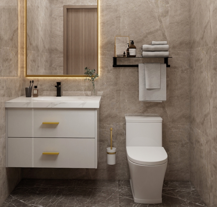 Stylish double-sink vanity with a marble top, white cabinets, and gold-framed mirror in a beige-toned bathroom.