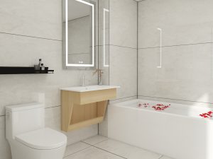 Bright bathroom featuring a modern floating vanity in light wood with a white countertop, set against minimalist beige tiles and highlighted by an illuminated rectangular mirror.