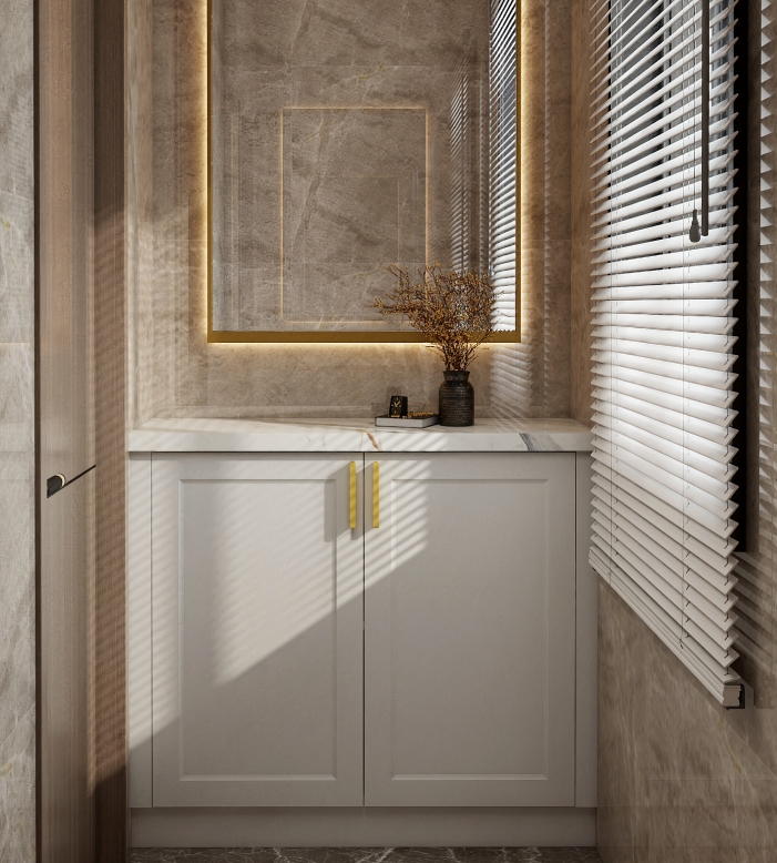 Double vanity with marble countertop, white cabinetry, and gold handles, featuring a large gold-framed mirror.