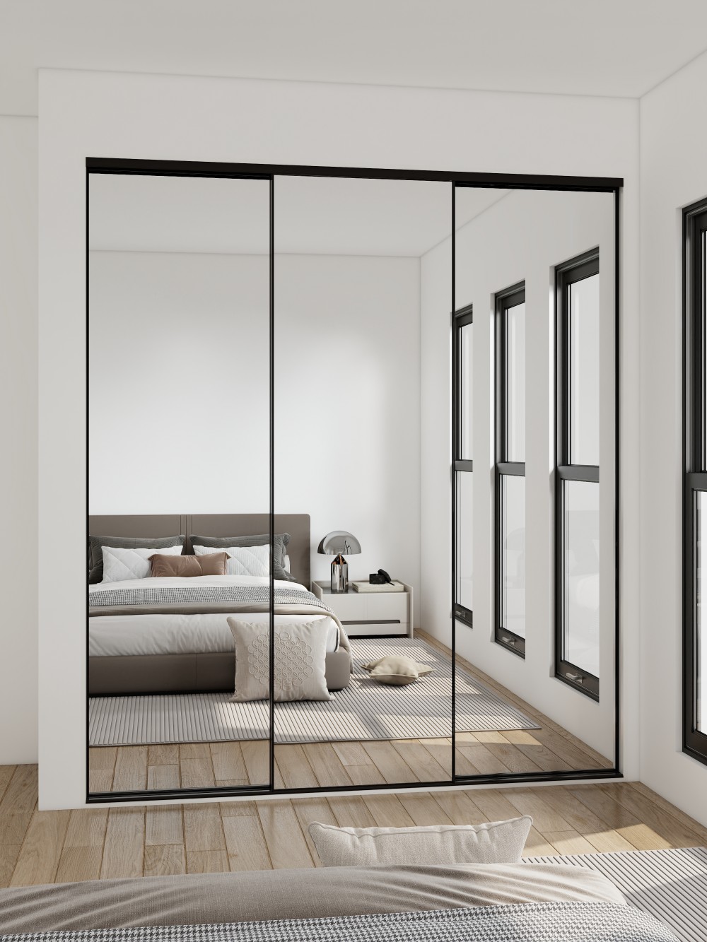 Mirrored sliding doors in a modern bedroom reflecting the bed and room layout, enhancing space and style.