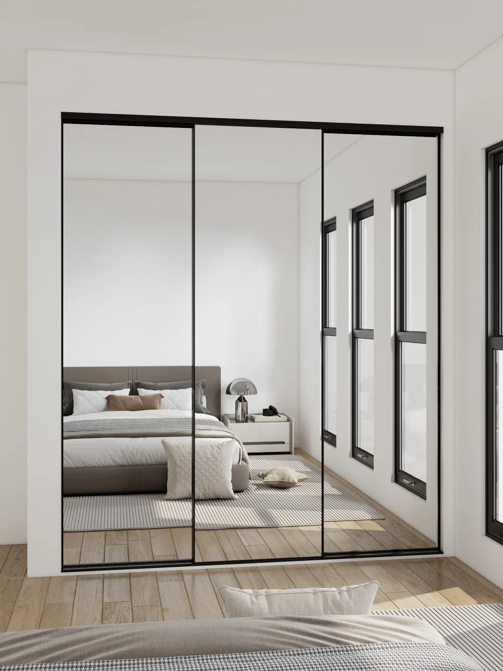 Mirrored sliding doors in a modern bedroom reflecting the bed and room layout, enhancing space and style.