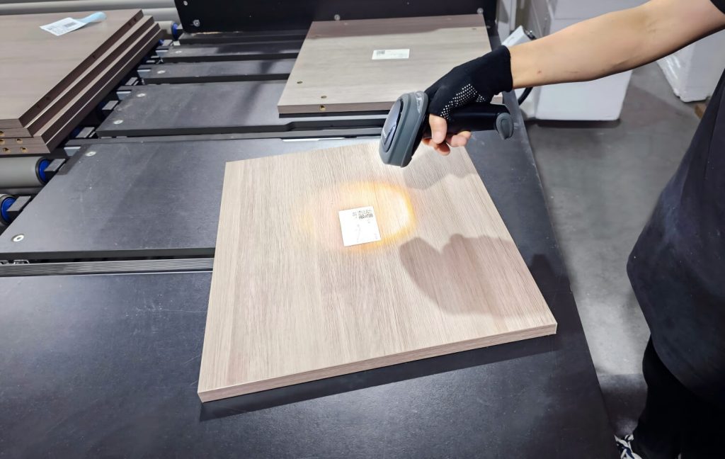 PA Home quality inspector scanning wood panel with barcode scanner for quality assurance and project tracking