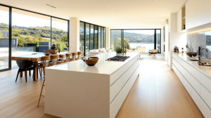 Sleek white kitchen island with modern appliances and stunning open views, creating a spacious and inviting atmosphere.