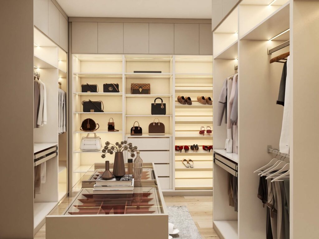 Walk-in closet with motion-sensor LED smart lighting system, displaying organized clothing, shoes, and accessories.