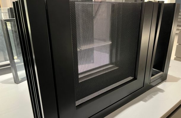 Custom aluminum window frame with mesh screen.