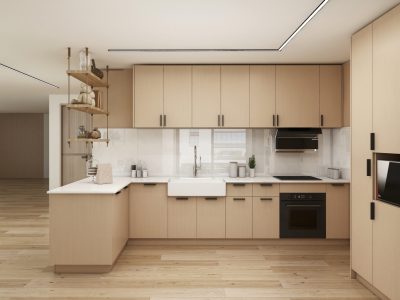 Minimalist kitchen with light wood cabinets and white countertops.