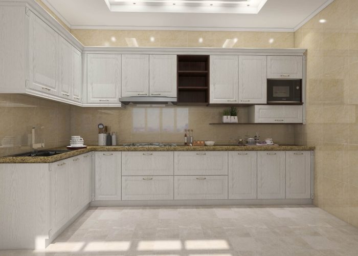 Modern white PVC kitchen cabinets with a granite countertop and superior moisture resistance for durability.